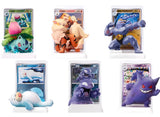 Collection of Pokémon trading cards with corresponding figures on a white background